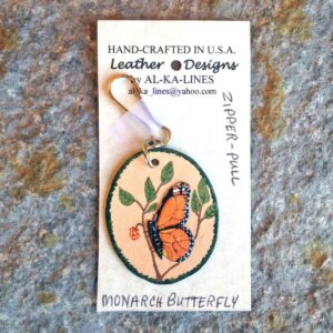 Leather made butterfly zipper pull.