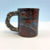 Bear scene on a mug with rock style handle.