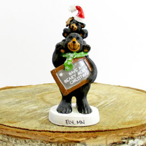 Resin black bear with cub on shoulder with Merry Christmas ornament.