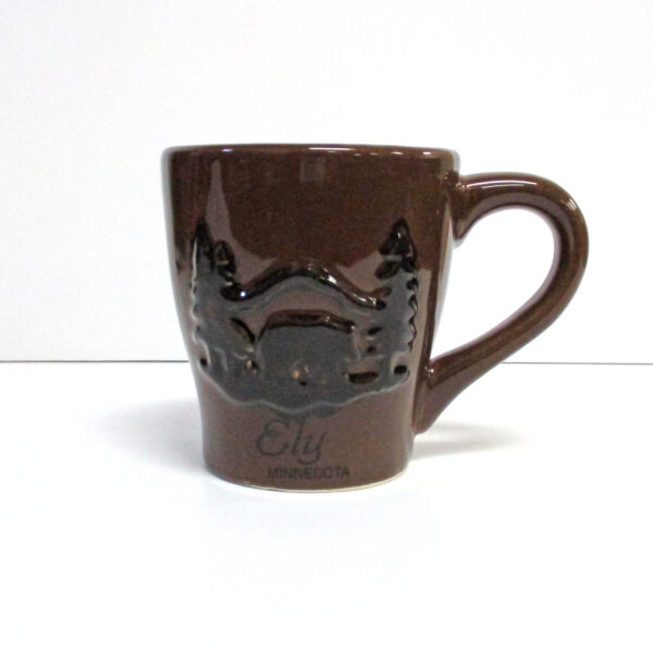 Ceramic brown mug with black embossed black bear on front.